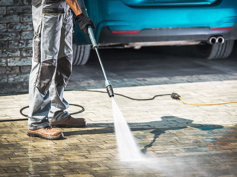 Jet washing and cleaning driveway