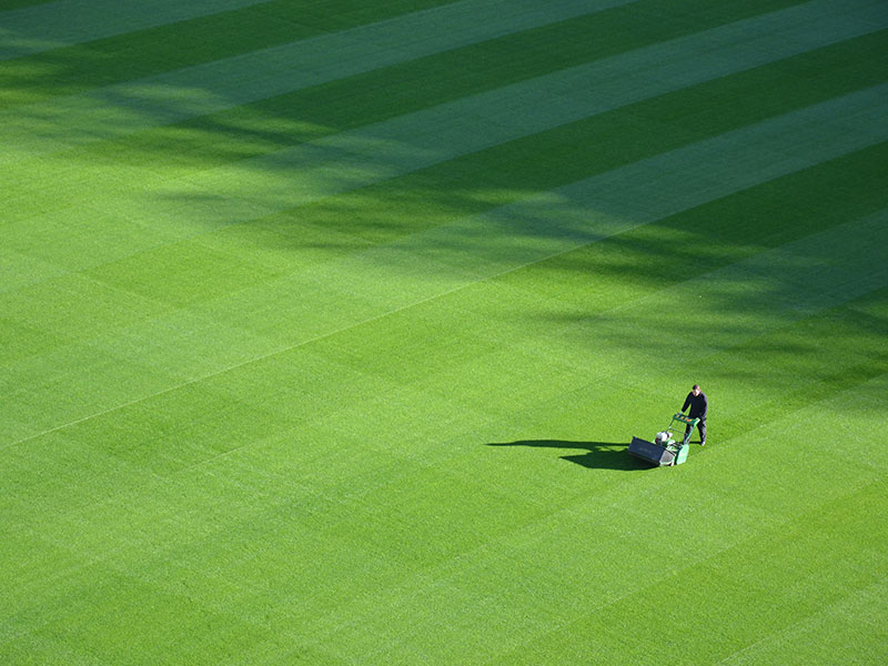 Mowing Football Pitch in Oxshott with lawnmower